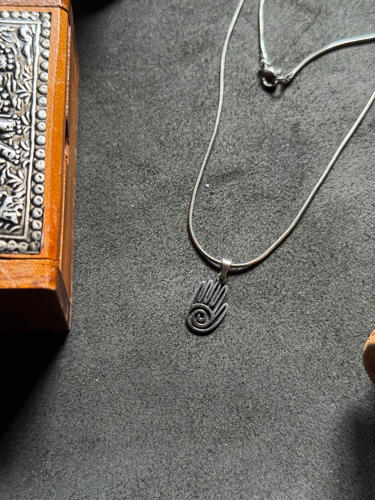Spiral hamsa hand silver stainless steel necklace in 55 cm chain