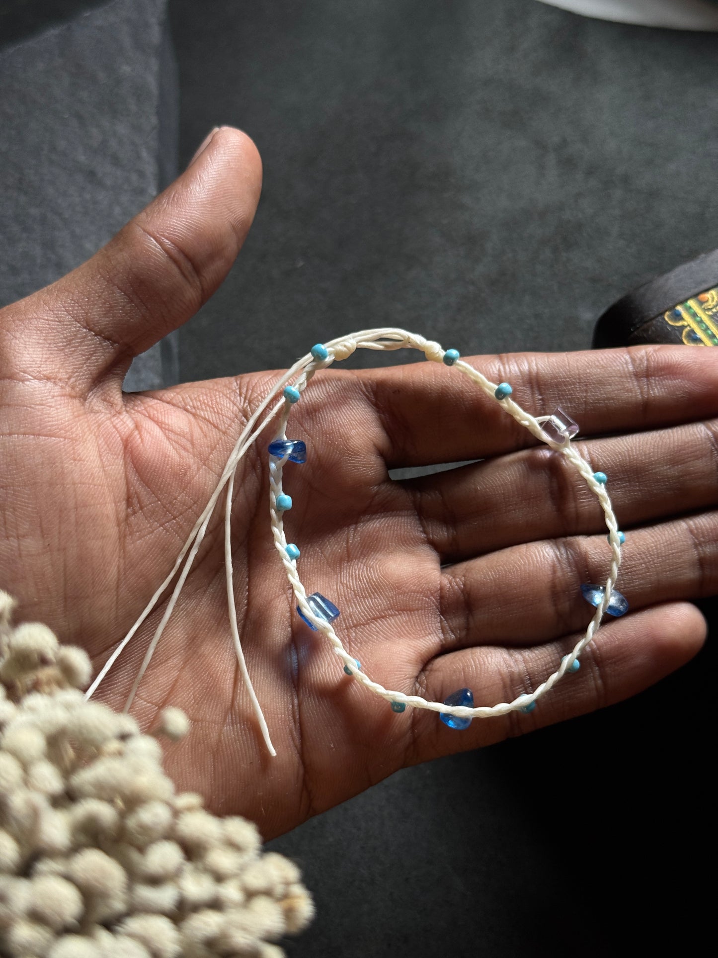 White macramé anklet with blue stones