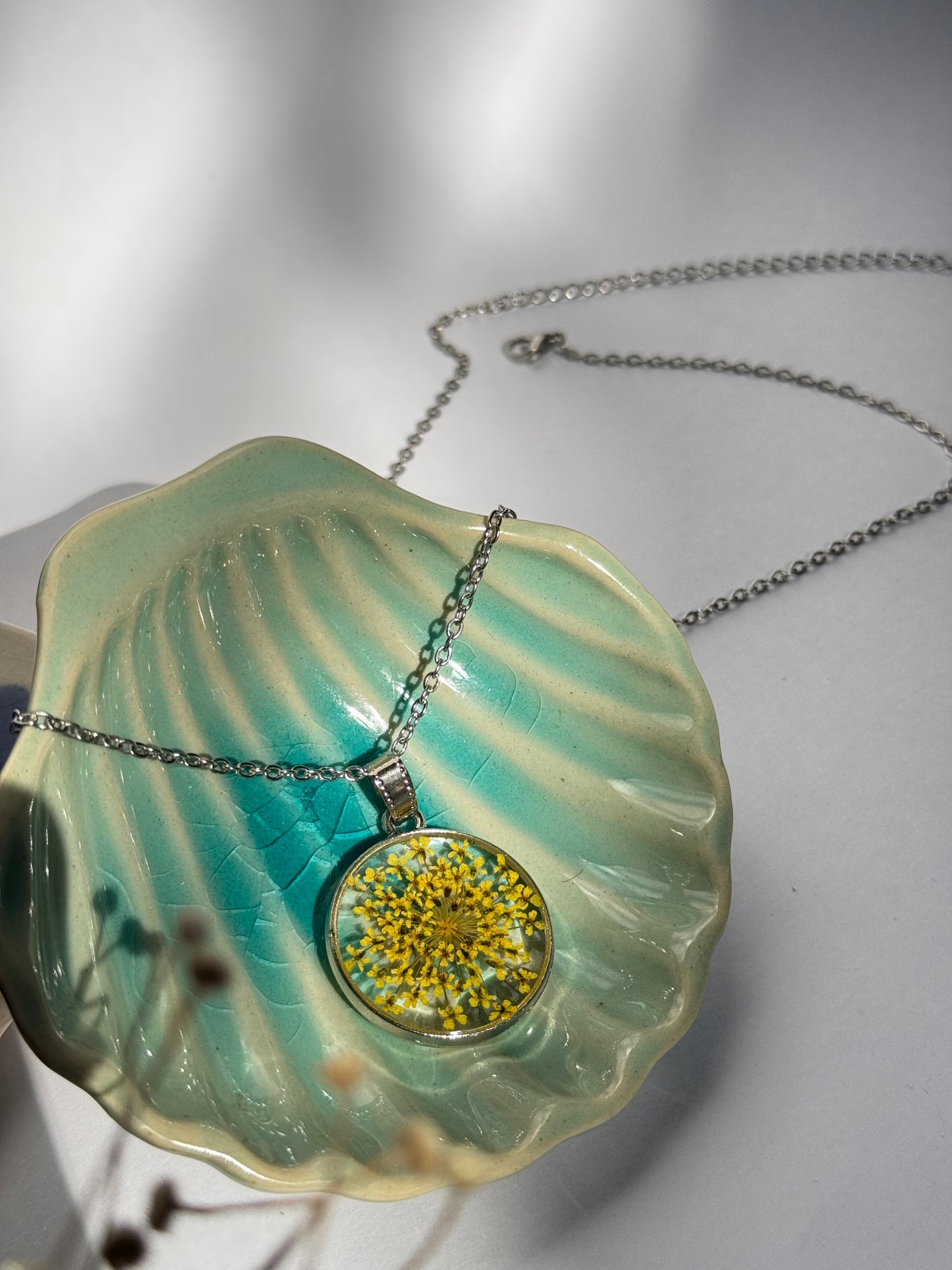 Yellow queen anne's lace round stainless steel necklace