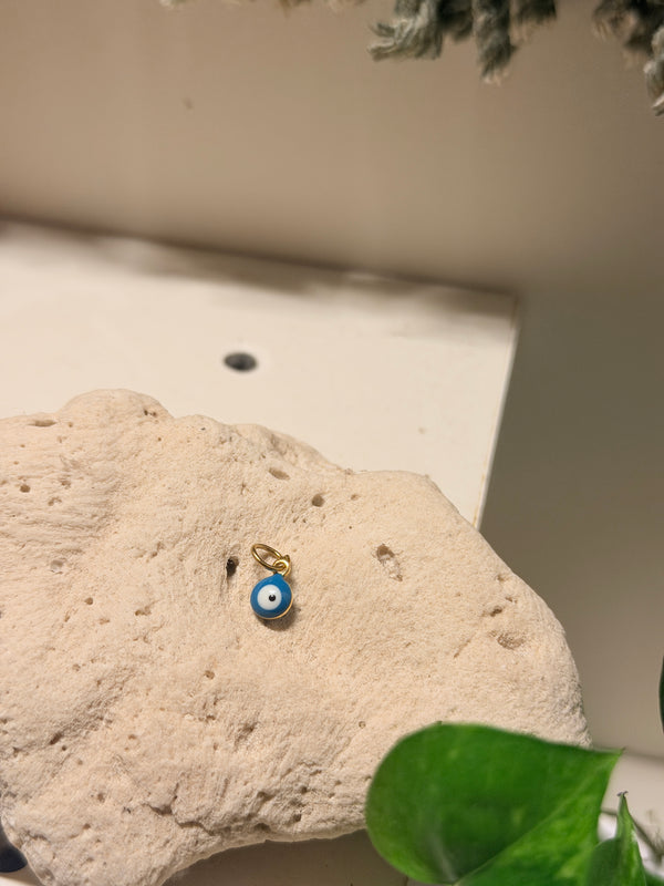 Tiny evil eye pendant