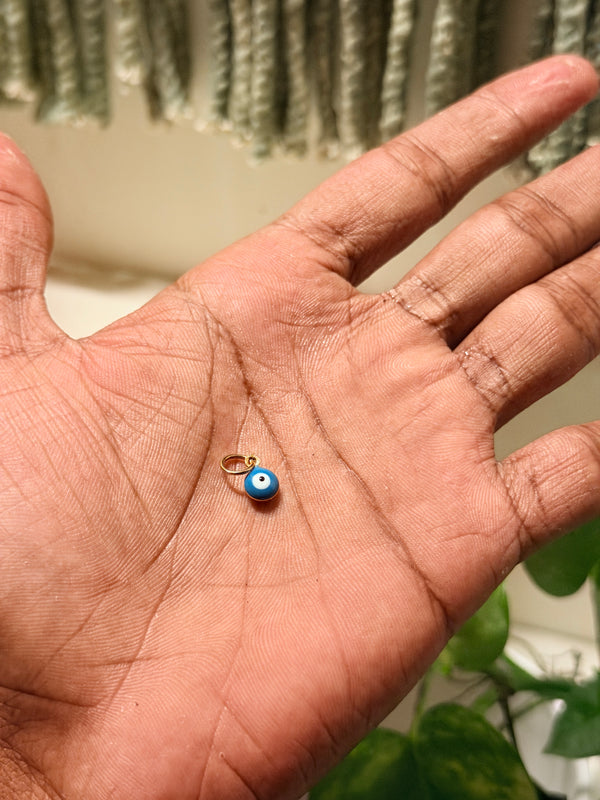Tiny evil eye pendant
