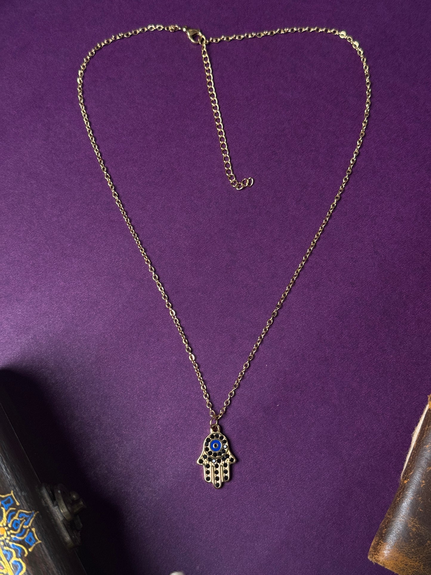 Hamsa hand 18k gold plated black stone embedded stainless steel necklace