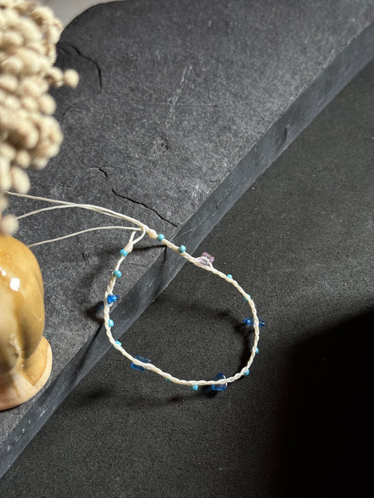 White macramé anklet with blue stones