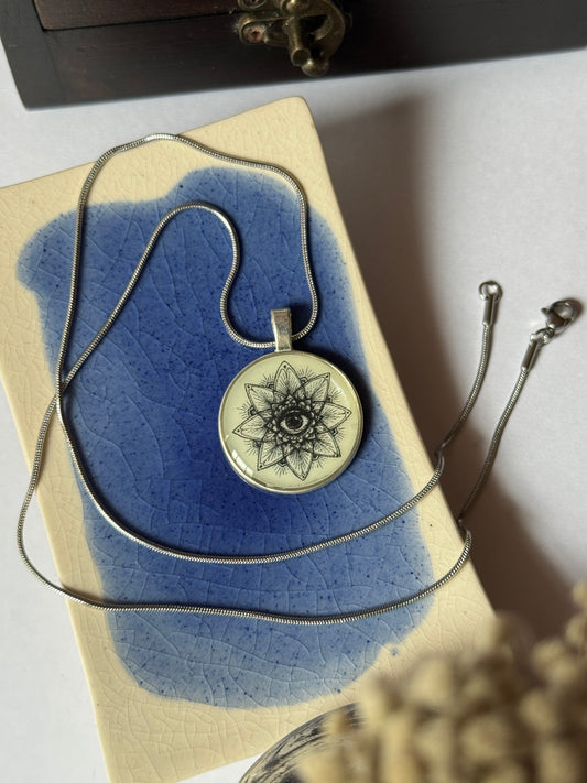 Glow in the dark eye mandala b/w resin necklace in 1.2 ss