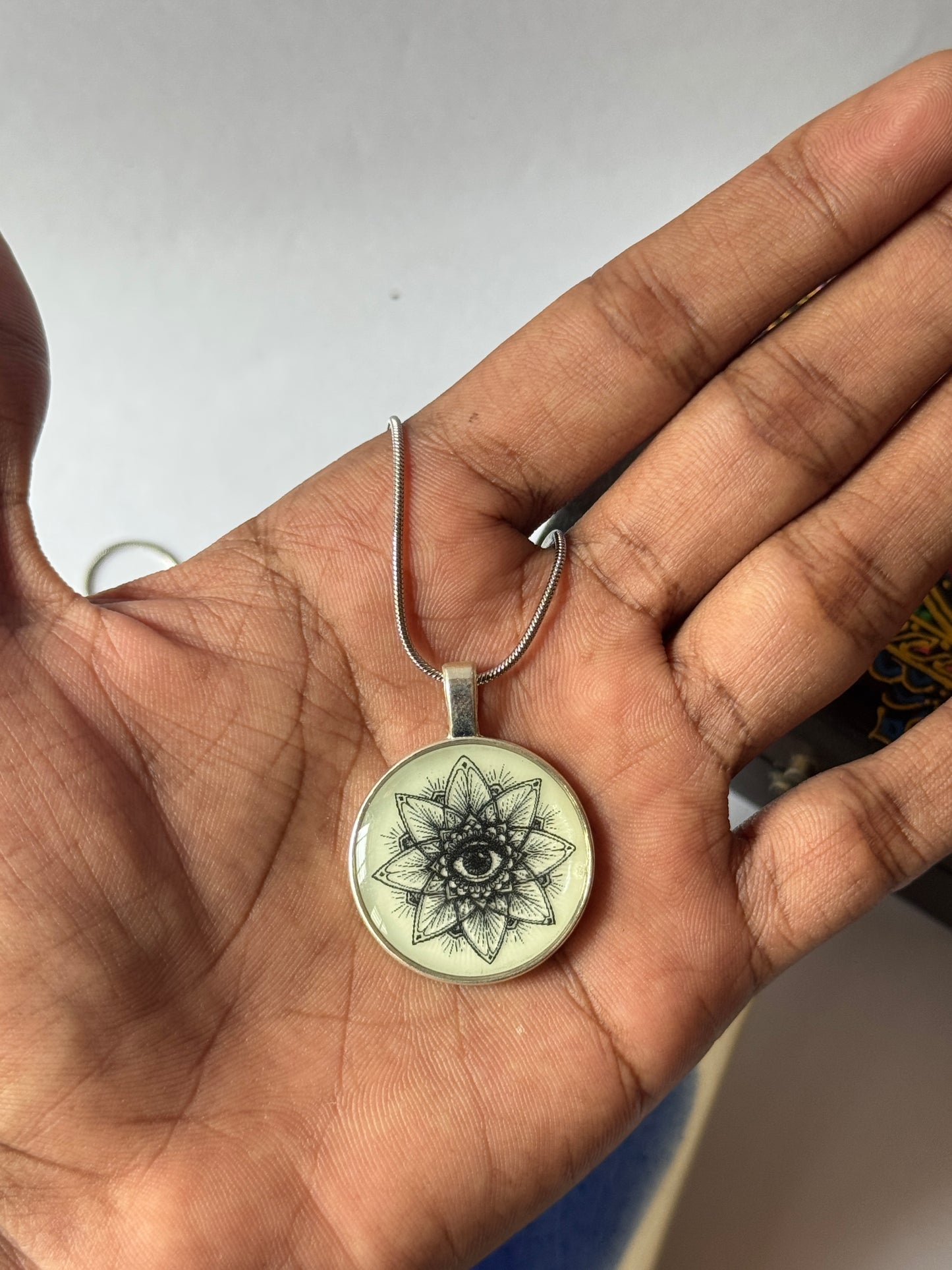 Glow in the dark eye mandala b/w resin necklace